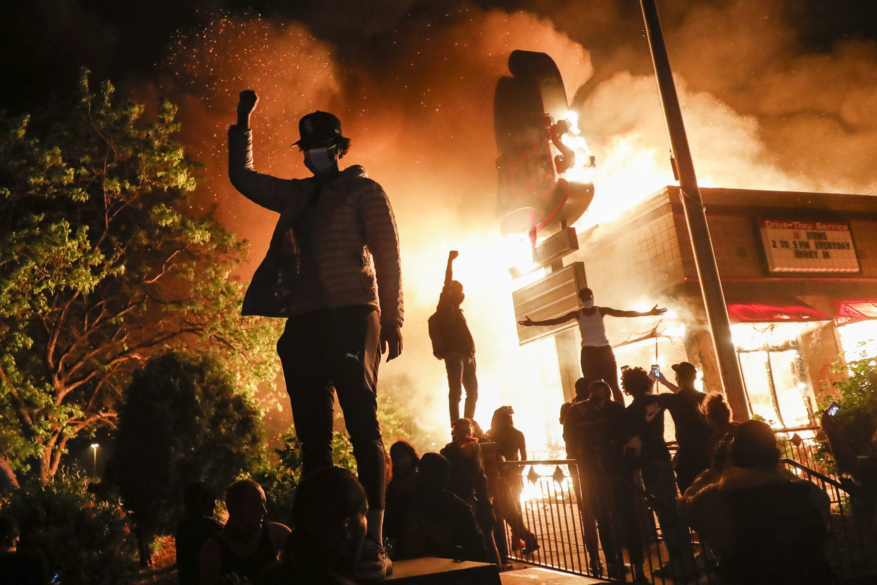 George Floyd protesters set Minneapolis police station afire